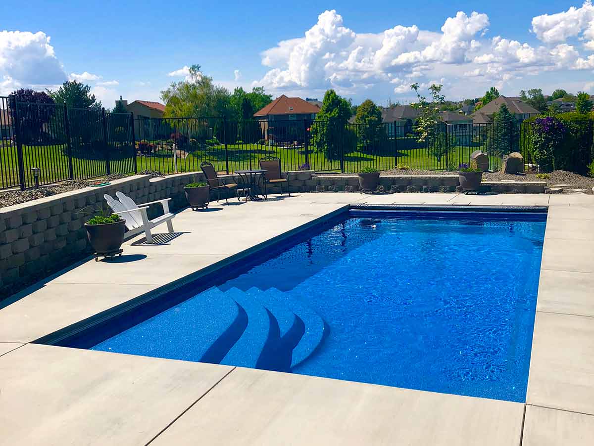 OLYMPIA 12 Family enjoying custom swimming pool built by Copano Pools and Spas in Selma, TX</p> <p>